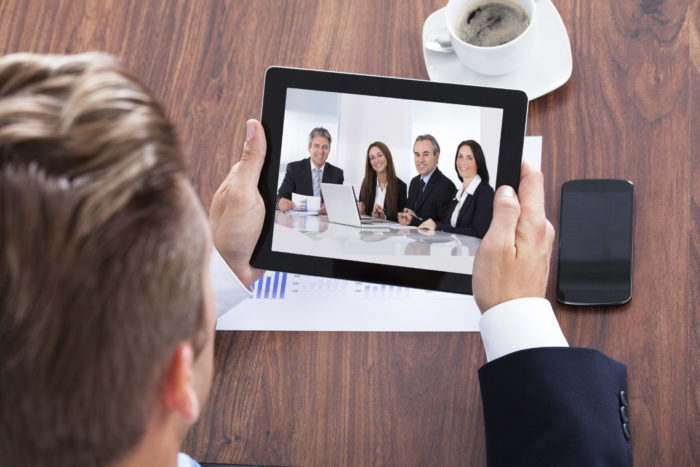 Portrait Of A Businessman Looking At Digital Tablet