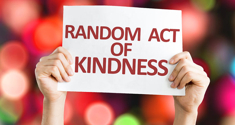 58084506 - hands holding random act of kindness card with bokeh background