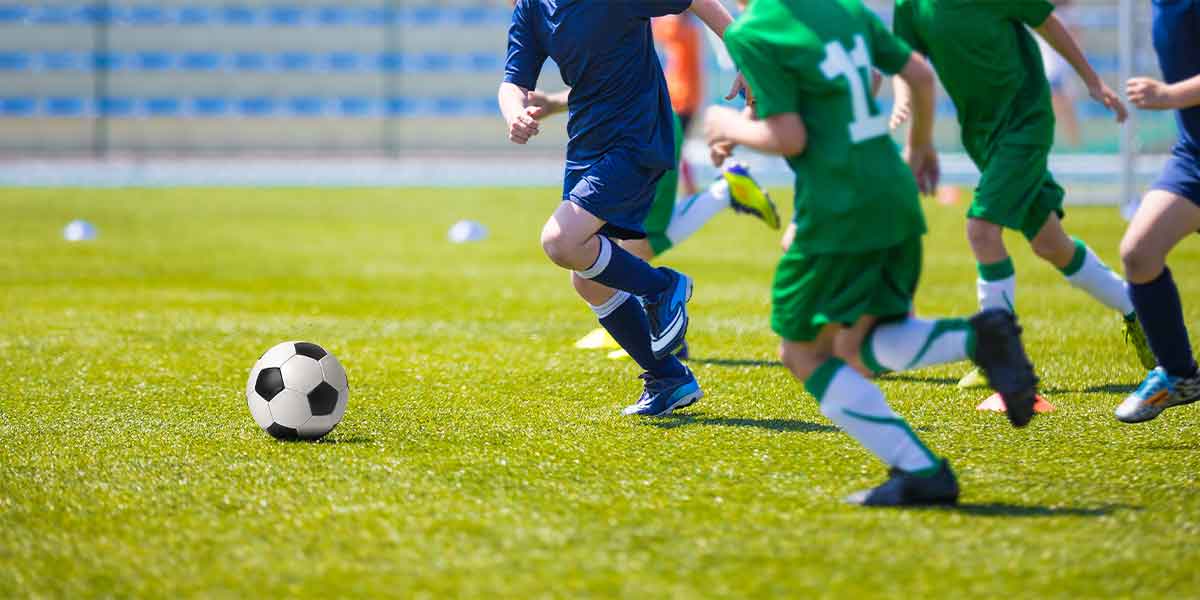 kids playing soccer football